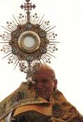 Pope John Paul II processing with the Blessed Sacrament of the Eucharist