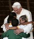 Papa Benedetto hugging children